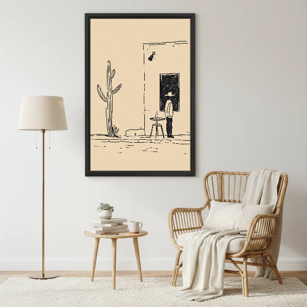 Desert Cafe Sketch Canvas Wall Art framed beside a wicker armchair with floor lamp.