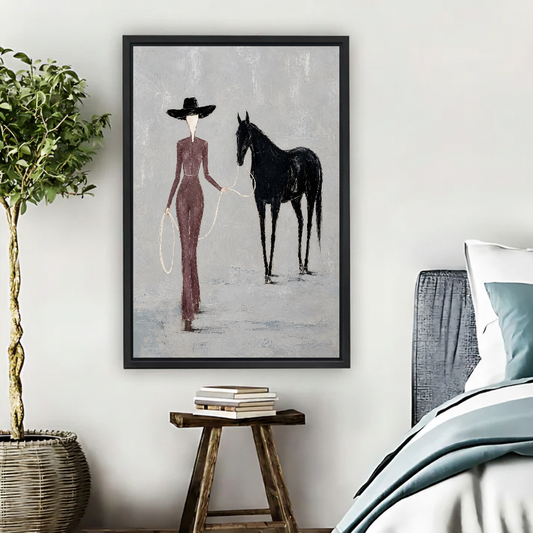 Elegant Woman Horse Canvas Wall Art framed beside a blue bed with books and leafy plant.