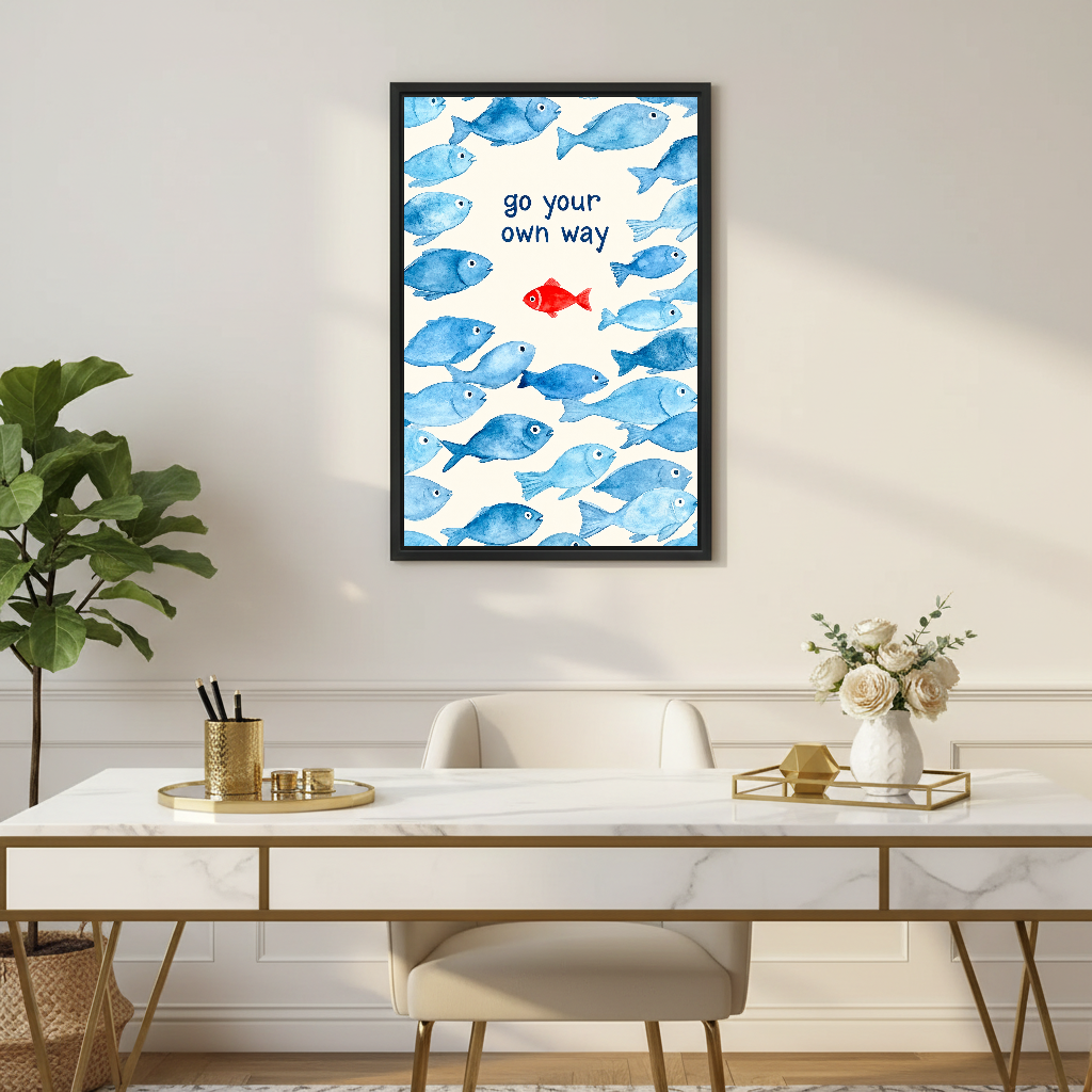 Go Your Way Fish Canvas Wall Art framed above a white desk with flowers and gold accents.