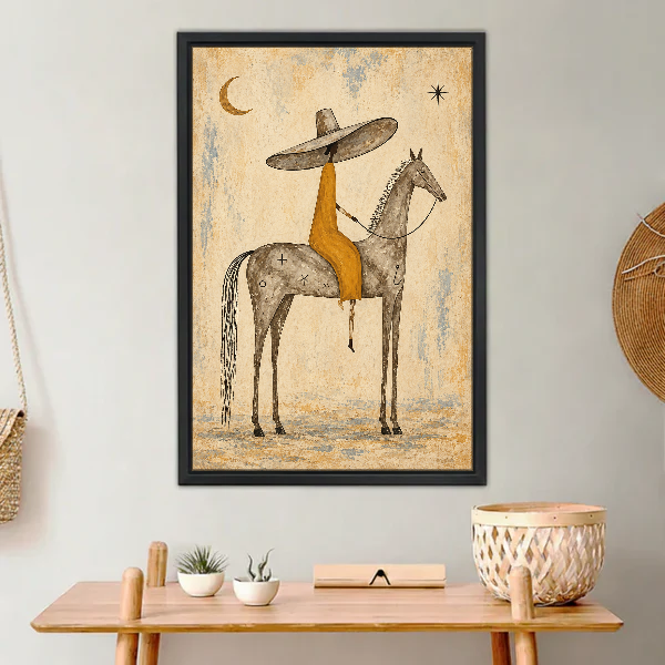 Sombrero Horse Rider Canvas Wall Art framed above a light wood console with cacti.