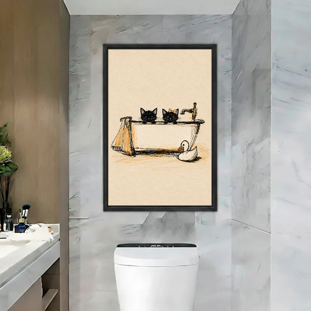 Bathroom Cats Canvas Wall Art framed above a toilet in a marble bathroom.