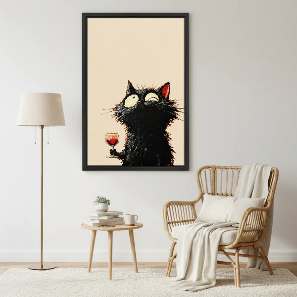 Wide Eyed Wine Cat Canvas Wall Art framed beside a wicker armchair with floor lamp.