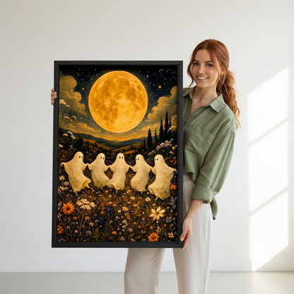 Moonlit Dancing Ghosts Canvas Wall Art held in a black frame by a standing woman in green.