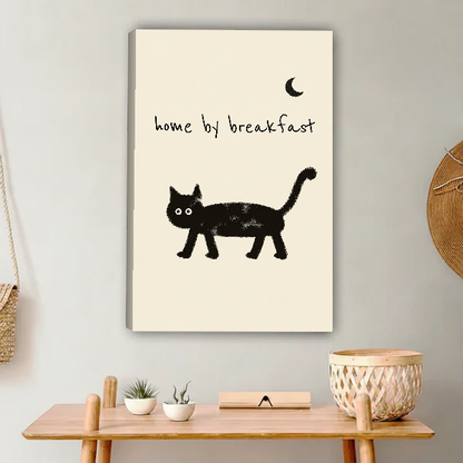 Home By Breakfast Cat Canvas Wall Art unframed above a light wood console and woven basket.