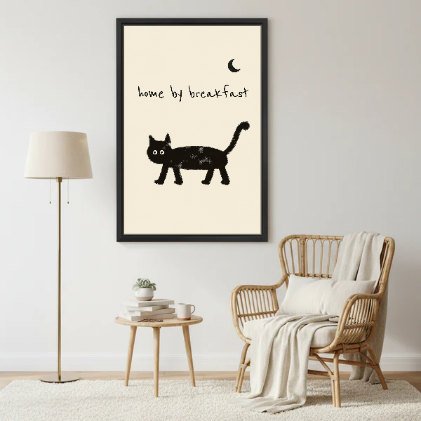 Home By Breakfast Cat Canvas Wall Art framed beside a wicker armchair with floor lamp.
