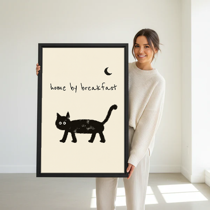 Home By Breakfast Cat Canvas Wall Art held in a black frame by a standing woman in white.