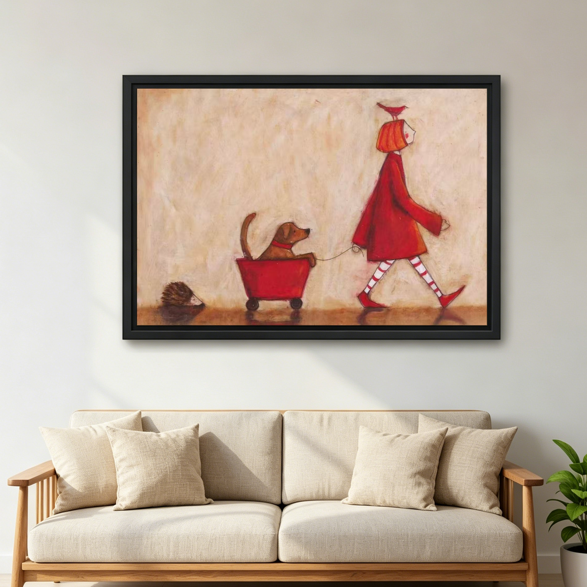 Red Coat Dog Canvas Wall Art framed above a cream sofa with wooden arms.