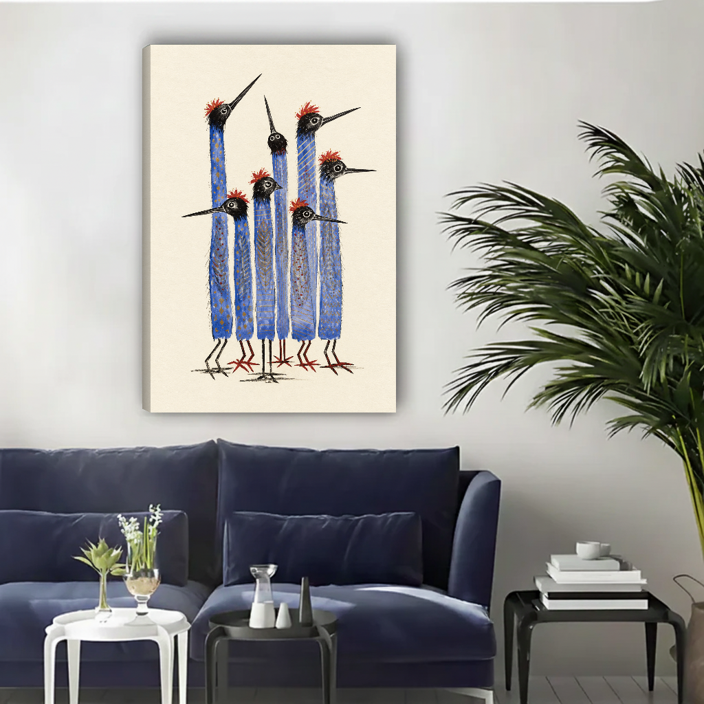 Tall Blue Birds Canvas Wall Art unframed above a navy sofa beside a leafy palm.