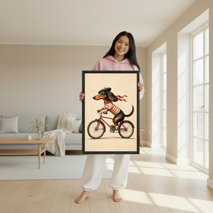 Cycling Dachshund Canvas Wall Art held in a black frame by a woman wearing pink.