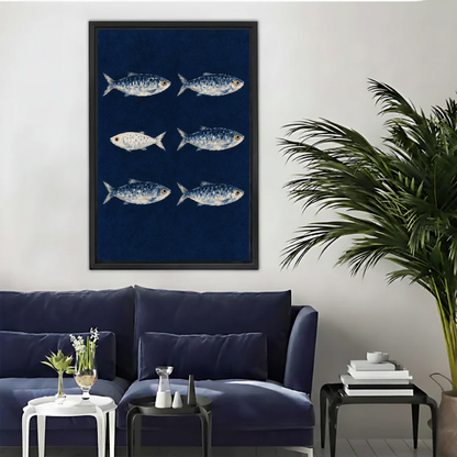 Navy Sardine Canvas Wall Art framed above a navy sofa with palm and side tables.