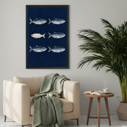 Navy Sardine Canvas Wall Art framed above a cream armchair with green throw.