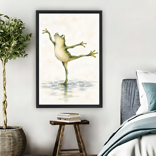 Ballet Frog Canvas Wall Art framed beside blue bedding, a leafy plant, and books.
