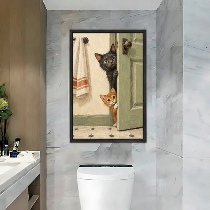 Doorway Cats Canvas Wall Art framed above a toilet in a marble bathroom.