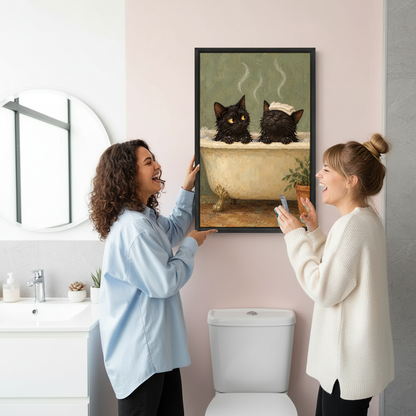 Bubble Bath Cats Canvas Wall Art held by two women beside a bathroom mirror and toilet.