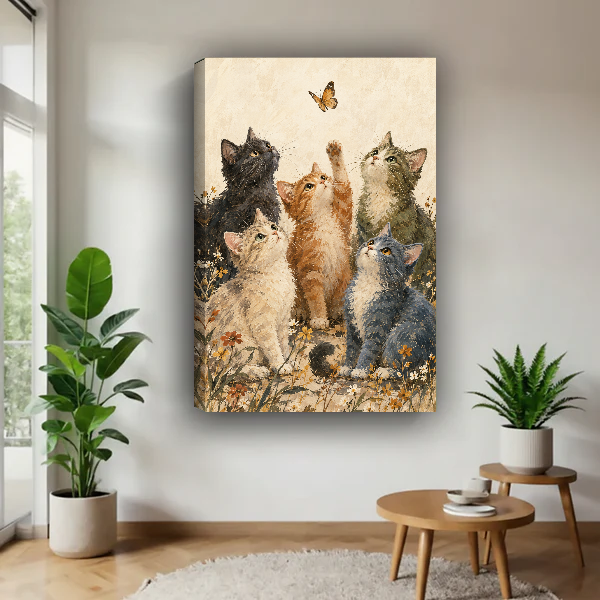 Butterfly Kittens Canvas Wall Art unframed above a wood table with green plants.