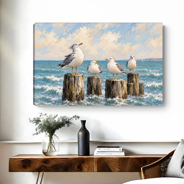 Coastal Gull Gathering Canvas Wall Art unframed above a wood console with black and white vases.
