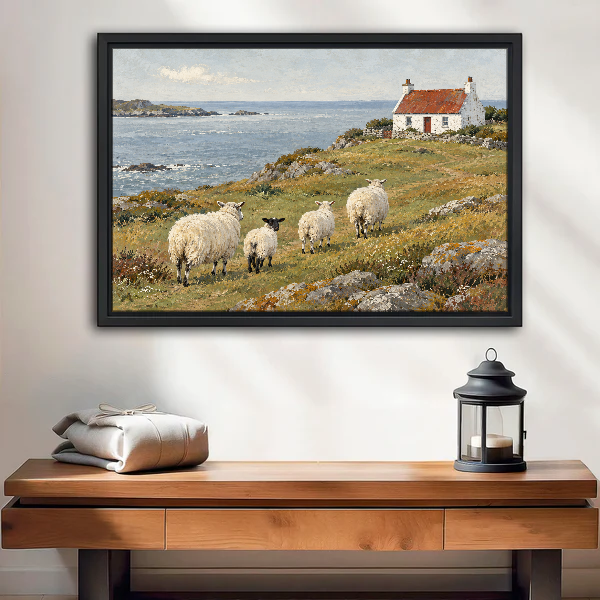 Coastal Sheep Cottage Canvas Wall Art framed above a wood console with linen and lantern.