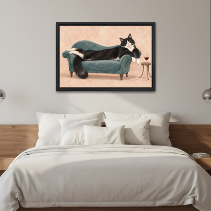 Lounging Tuxedo Cat Canvas Wall Art framed above white bedding and a warm wood headboard.