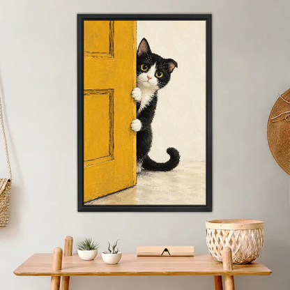 Peekaboo Kitten Canvas Wall Art framed above a light wood console with cacti.