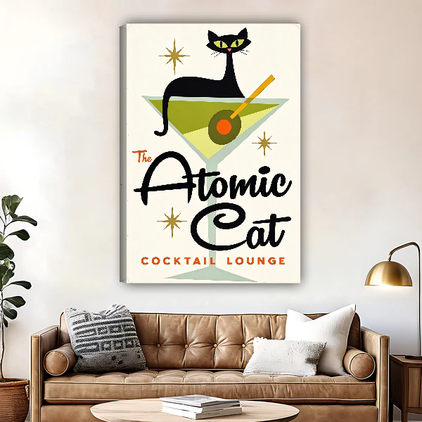 Atomic Cat Cocktail Canvas Wall Art unframed above a brown leather sofa and brass lamp.