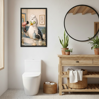 Self Care Seagull Canvas Wall Art framed above a toilet beside wood vanity and round mirror.