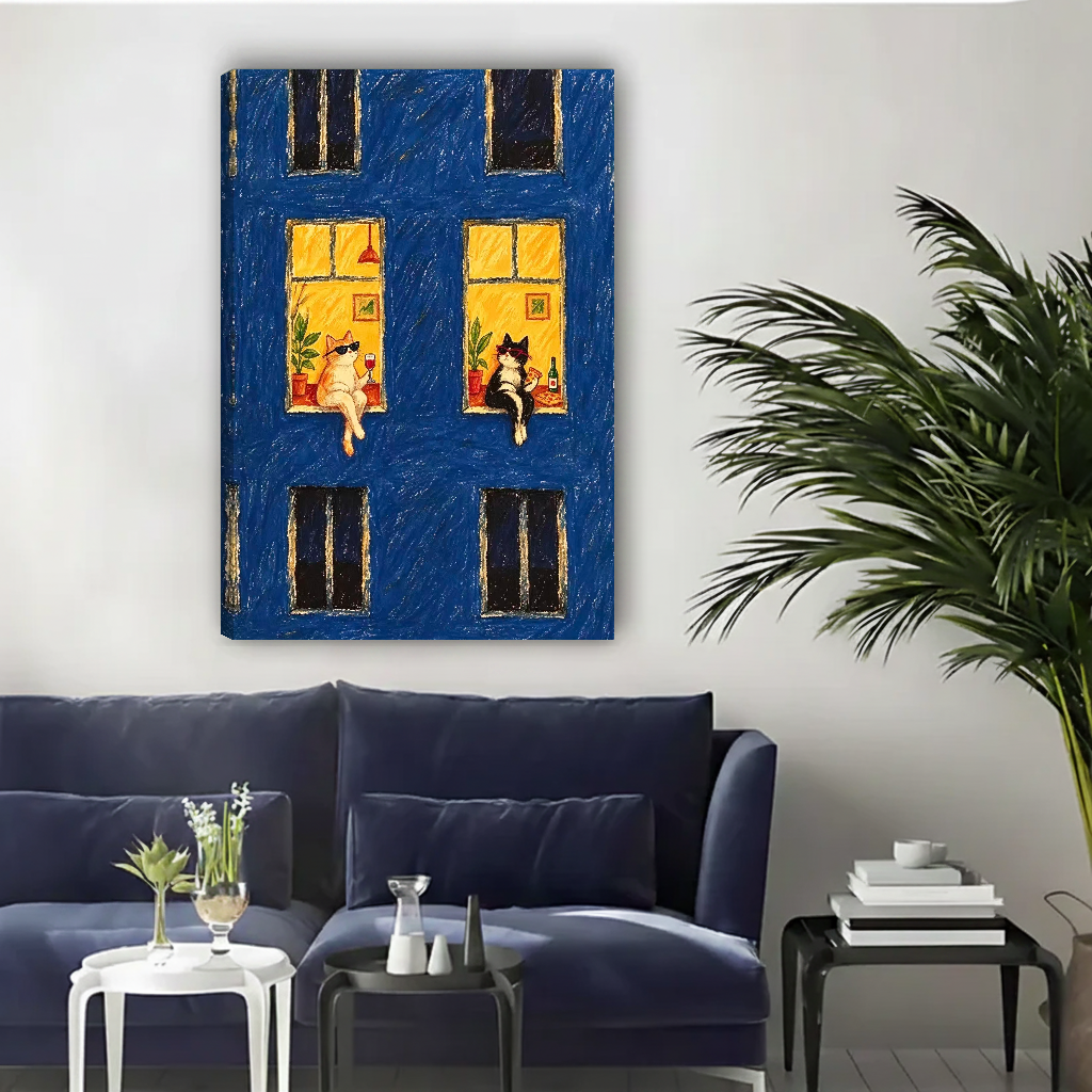 Midnight Window Cats Canvas Wall Art unframed above a navy sofa beside a leafy palm.
