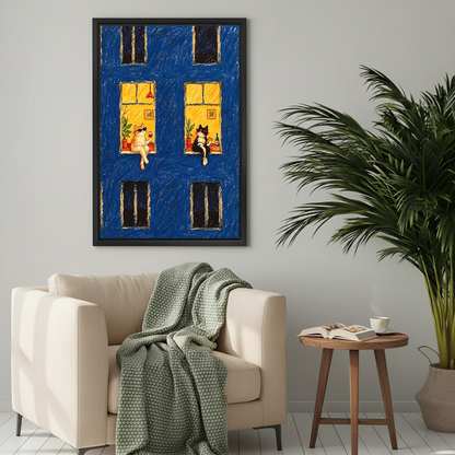Midnight Window Cats Canvas Wall Art framed above a cream armchair with green throw.