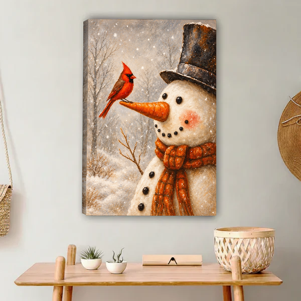 Snowman Cardinal Friend Canvas Wall Art unframed above a light wood console and woven basket.
