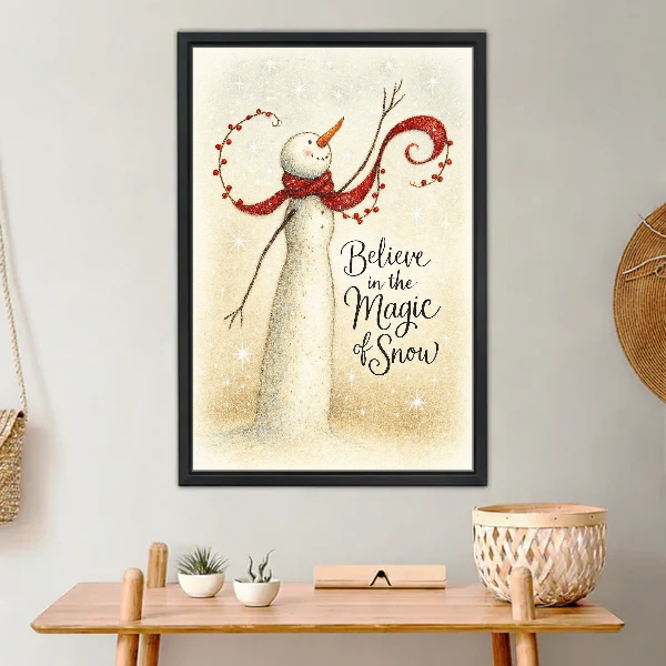 Magic of Snow Snowman Canvas Wall Art framed above a light wood console with cacti.