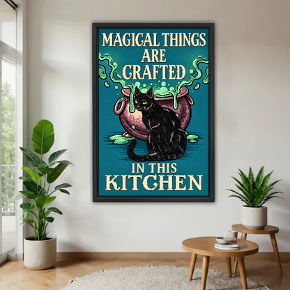 Magical Kitchen Cat Canvas Wall Art framed above a pale wood table beside green plants.