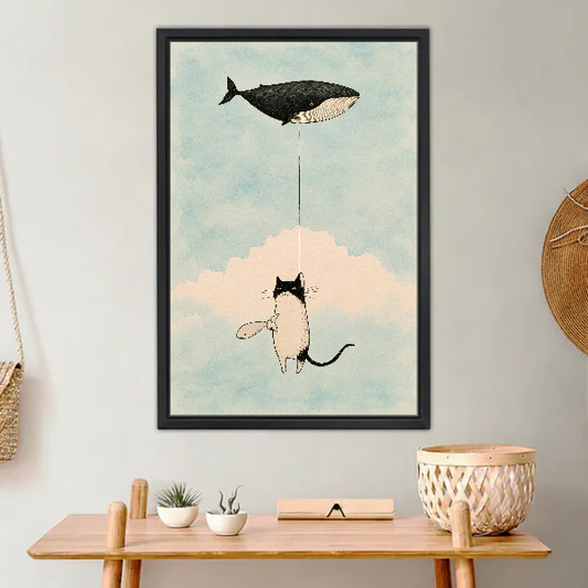 Cat Whale Balloon Dream Canvas Wall Art framed above a light wood console with cacti.