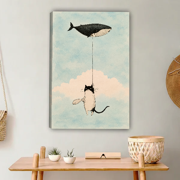 Cat Whale Balloon Dream Canvas Wall Art unframed above a light wood console and woven basket.