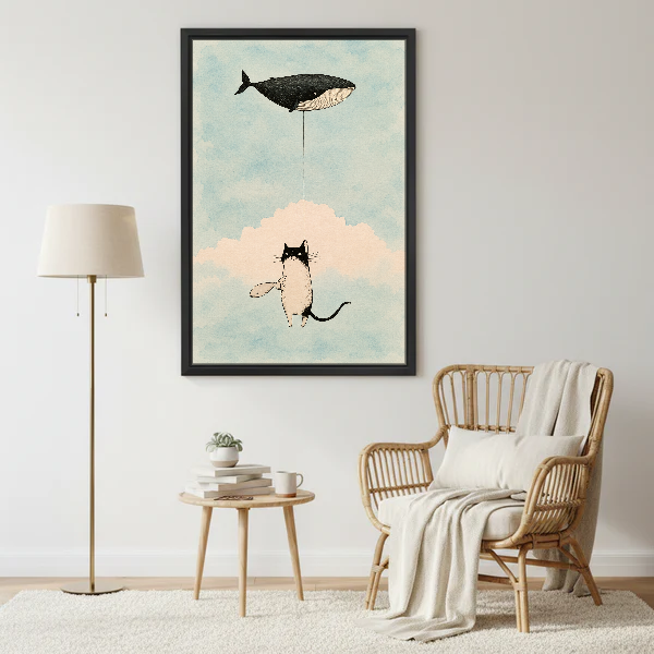 Cat Whale Balloon Dream Canvas Wall Art framed beside a wicker armchair and brass floor lamp.