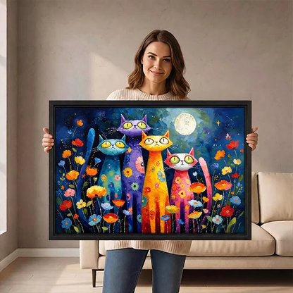 Colorful Night Cats Canvas Wall Art held by a woman before a neutral cream sofa.
