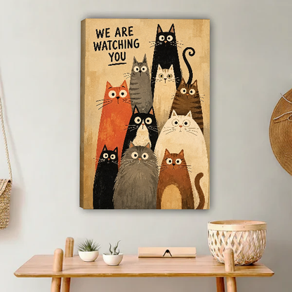 We Are Watching Cats Canvas Wall Art unframed above a light wood console and woven basket.