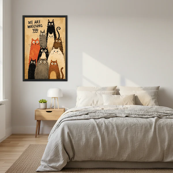 We Are Watching Cats Canvas Wall Art framed above cream bedding and pale wood nightstands.