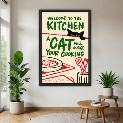 Kitchen Cat Food Critic Canvas Wall Art framed above a pale wood table beside green plants.