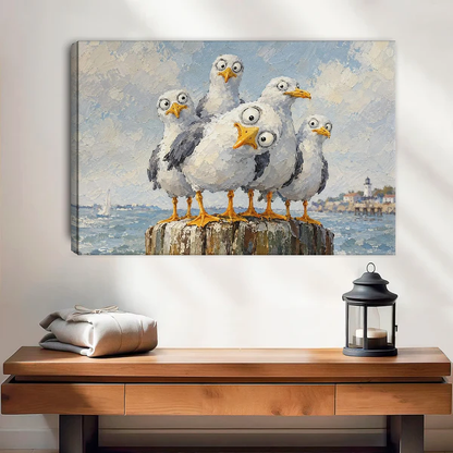 Curious Coastal Gulls Canvas Wall Art unframed above a wood console with lantern and folded linen.