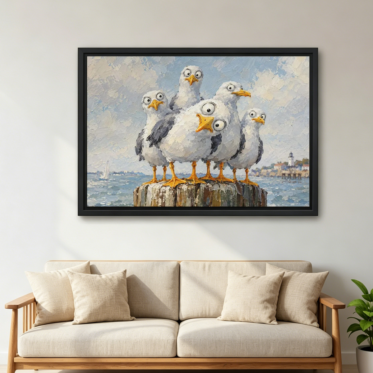 Curious Coastal Gulls Canvas Wall Art framed above a cream sofa with wooden arms.