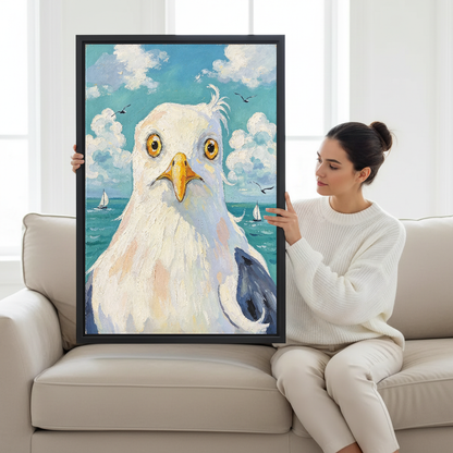 Wide Eyed Seagull Canvas Wall Art held by a seated woman beside a cream sofa.