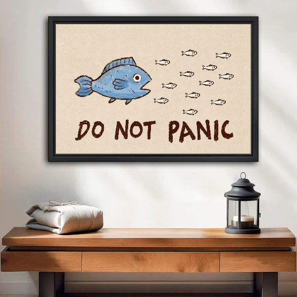 Do Not Panic Fish Canvas Wall Art framed above a wood console with lantern and folded linen.
