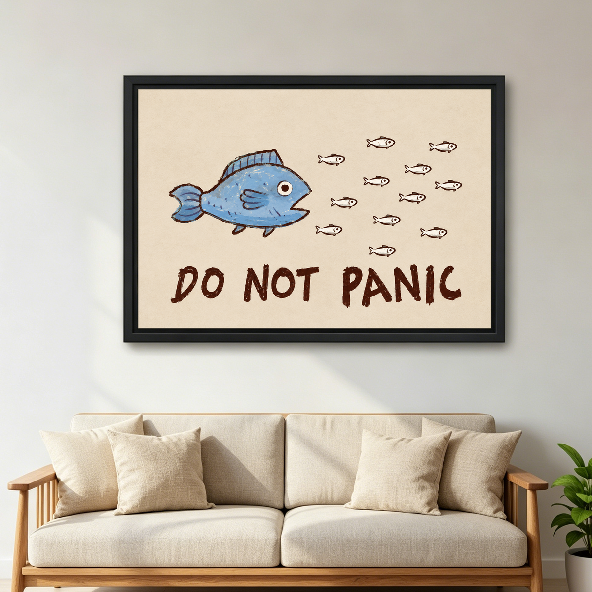 Do Not Panic Fish Canvas Wall Art framed above a cream sofa with wooden arms.