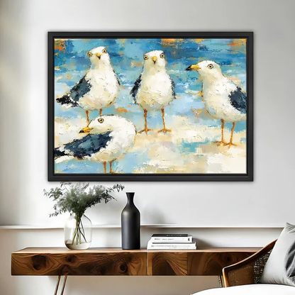 Seaside Gull Gathering Canvas Wall Art framed above a wood console with black vase and branches.