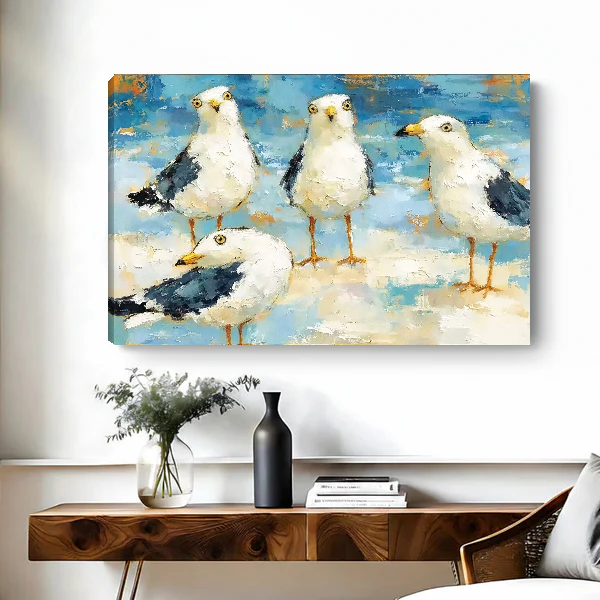 Seaside Gull Gathering Canvas Wall Art unframed above a wood console with black vase and branches.