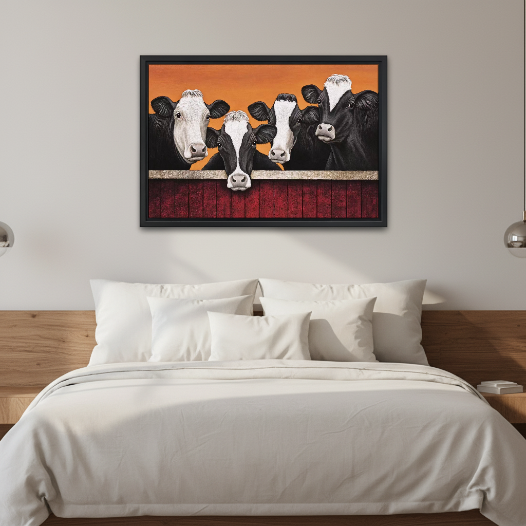 Four Curious Cows Canvas Wall Art framed above white bedding and wooden bedside tables.