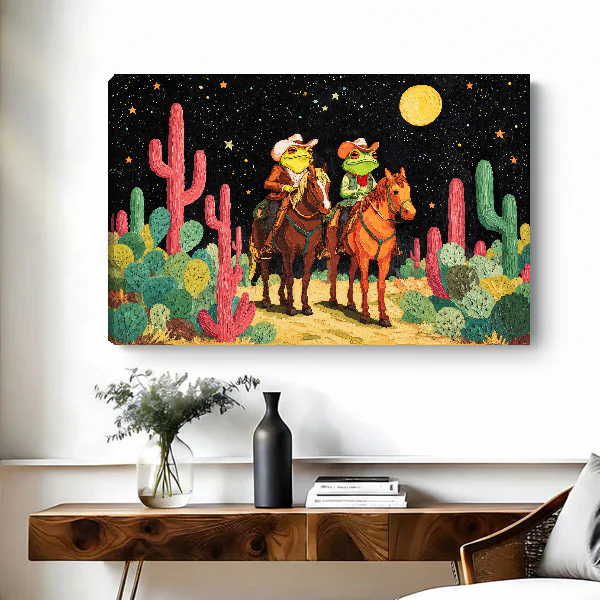 Moonlit Frog Cowboy Riders Canvas Wall Art unframed above a figured wooden console with a black vase.