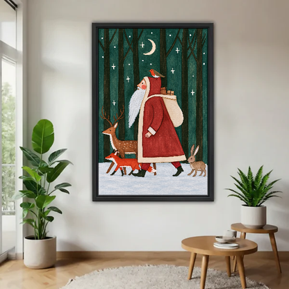 Santa Woodland Companions Canvas Wall Art framed above a pale wood table beside green plants.