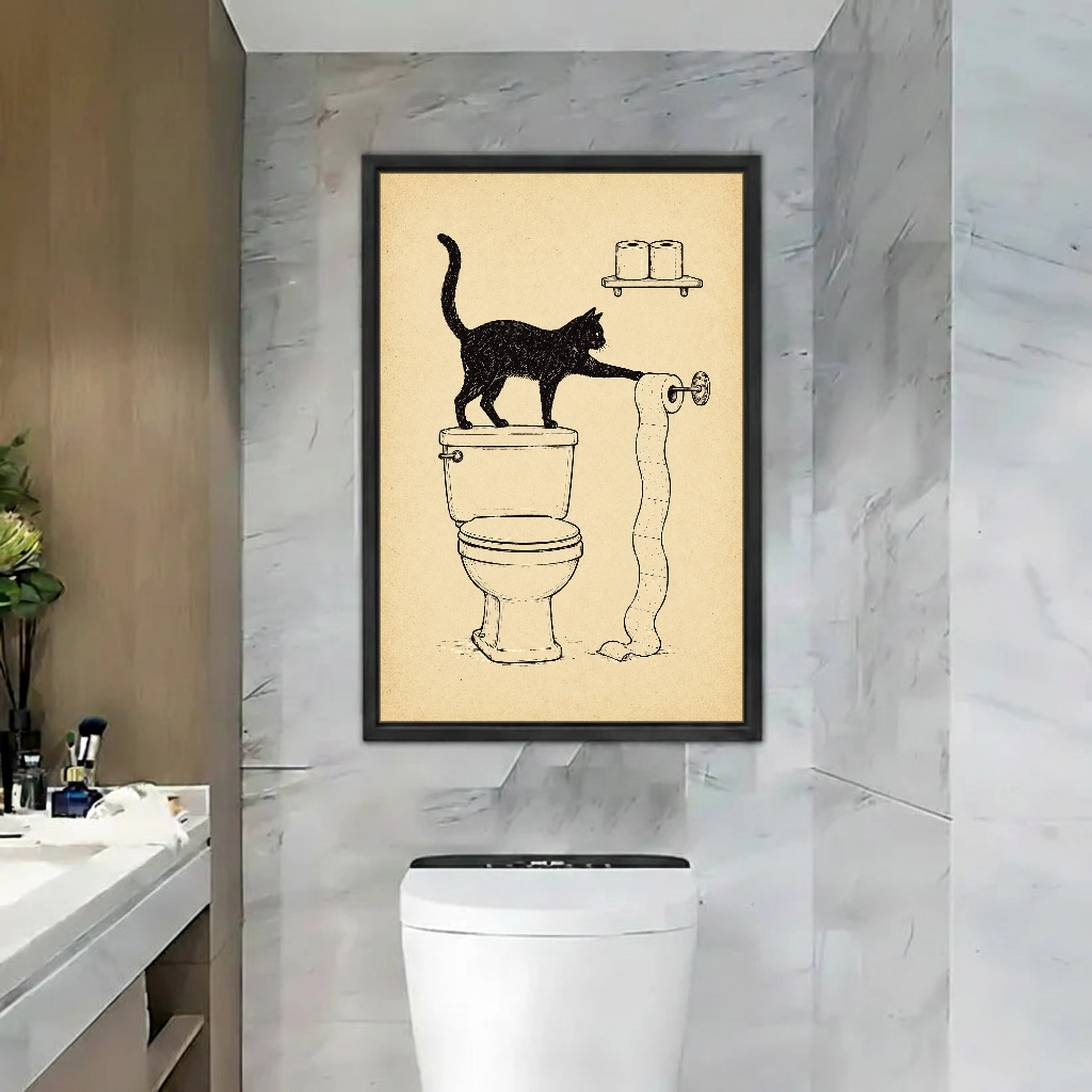 Toilet Paper Cat Mischief Canvas Wall Art framed above a toilet against gray marble bathroom walls.