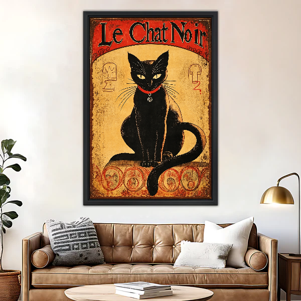 Le Chat Noir Portrait Canvas Wall Art framed above a brown leather sofa and brass lamp.