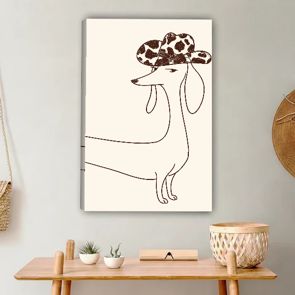 Cowboy Hat Dachshund Canvas Wall Art unframed above a light wood console and woven basket.